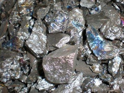 Alloys of titanium, copper, chromium, and zirconium